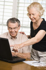 Elderly Couple with a Computer