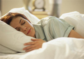 Women Sleeping in Bed on Pillow
